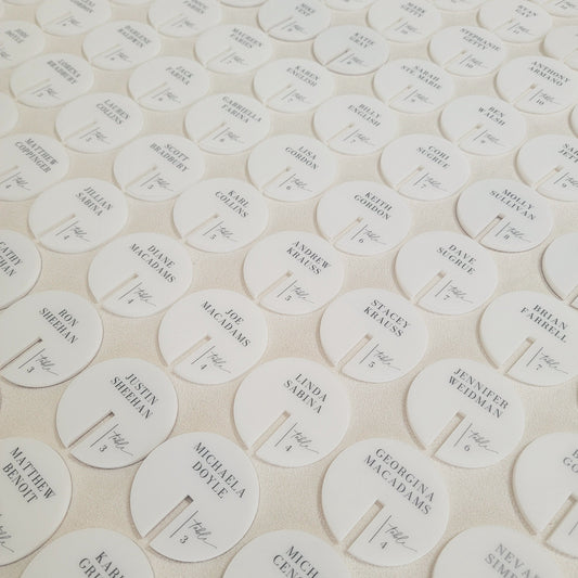 White personalized drink tags made from acrylic and black uv ink.